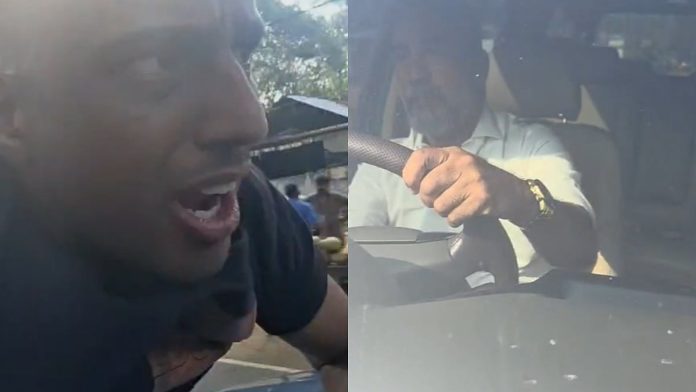 newsmalayalam_2025-11-21_ltzqkae4_യുവാവിനെ-കാറിന്റെ-ബോണറ്റിൽ-കിടത്തി-വാഹനം-ഓടിച്ചു